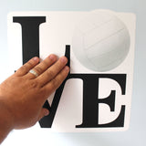 installation of a 11"h x 11"w vollyeball LOVE wall sticker