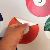 This wall print material is reusable. You can unpeel and move to another wall a number of times. It will need to be a smooth wall surface.