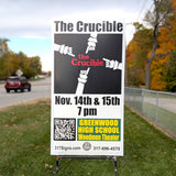 Outdoor event sign for 'The Crucible' at Greenwood High School with a QR code and contact information.