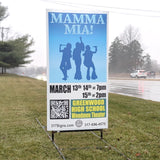 Outdoor promotional yard sign for 'Mamma Mia!' event at Greenwood High School.