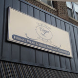 Rectangular Max Metal commercial sign displayed outdoors for Elegant L, located in Shelbyville, Indiana.