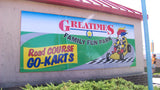 Custom printed aluminum composite business sign mounted on wall for Greatimes located in Indianapolis, Indiana